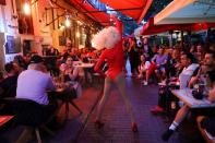 Draq queen Katherine Taylor performs during a drag queen show in a bar in Budapest