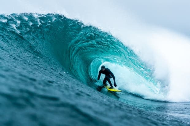 I’ll never forget this day. My mom passed away the night before taking this photo of Michael Darling. I swam for almost 6 hours to shoot the surf, trying to heal myself in the ocean.<p>Marcus Paladino</p>