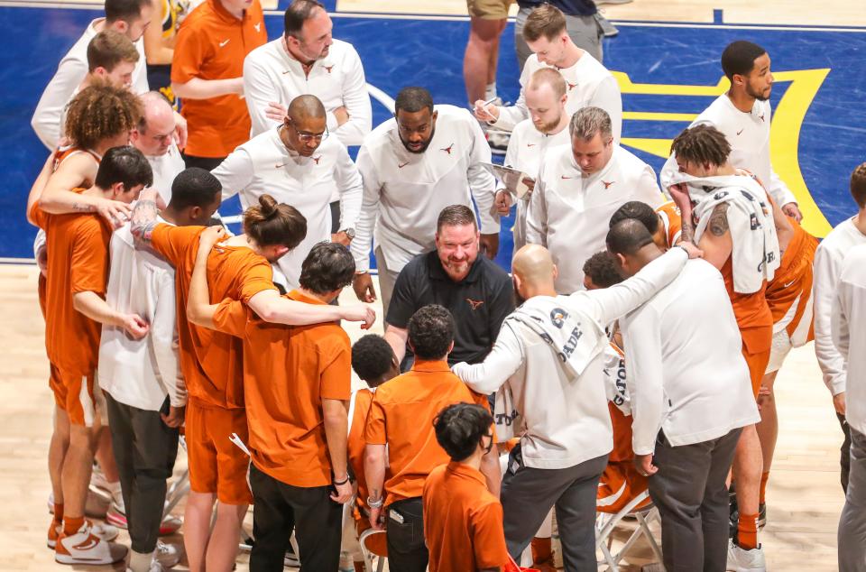 Texas coach Chris Beard, center, has hired another assistant with deep in-state ties in Brandon Chappell, who played at Lamar University and finished as that school's top all-time 3-point shooters.