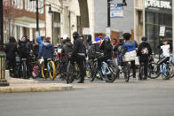 A bicycle meetup group of teenagers protest President Donald Trump ahead of the inauguration of President-elect Joe Biden and Vice President-elect Kamala Harris at the New York State Capitol Sunday, Jan. 17, 2021, in Albany, N.Y. (AP Photo/Hans Pennink)