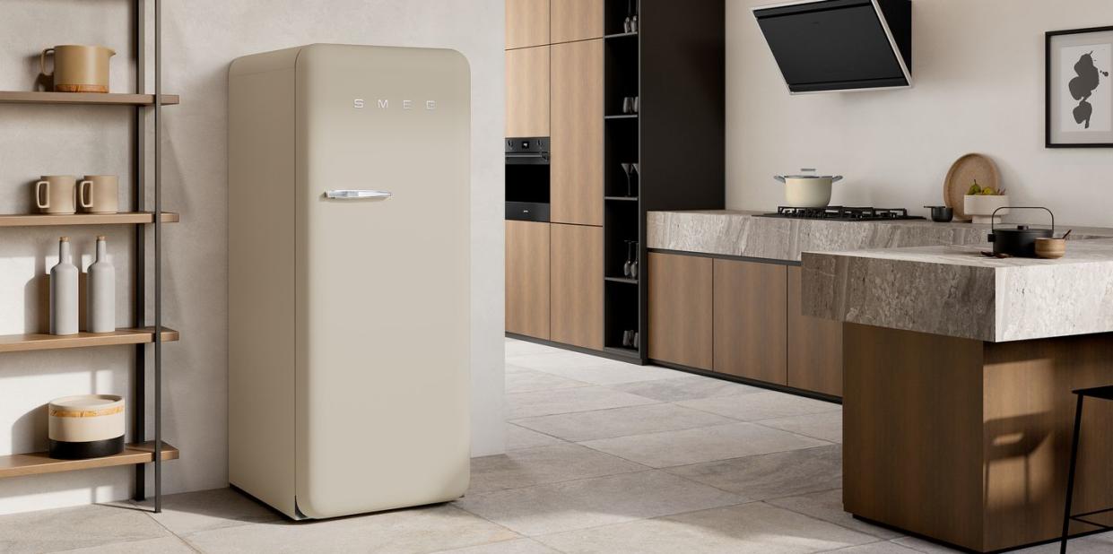 smeg fridge cream, a kitchen with a bar and a refrigerator