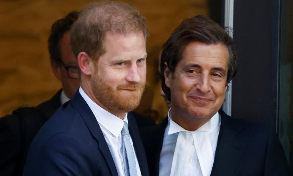 Prince Harry with his barrister David Sherborne outside the high court in London.