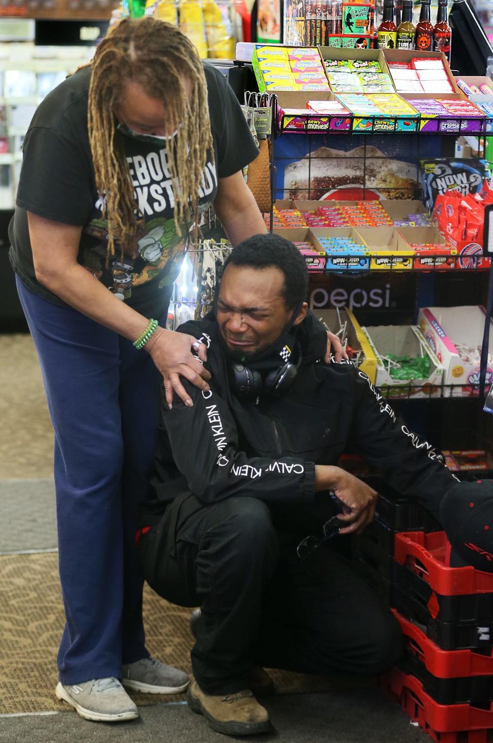 Norma Heard, owner of 2 Live Music in Akron, comforts customer Avery Norris, 25, of Akron, after he breaks down in tears of relief in reaction to the guilty verdict in the police killing of George Floyd in Minneapolis. The stress of Floyd's death, some leaders say, has influenced both the drug overdose and suicide rates in Greater Akron.