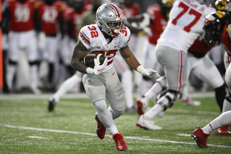 Ohio State running back TreVeyon Henderson (32) runs with the ball during the first half of an NCAA college football game against Maryland, Saturday, Nov. 19, 2022, in College Park, Md. (AP Photo/Nick Wass)