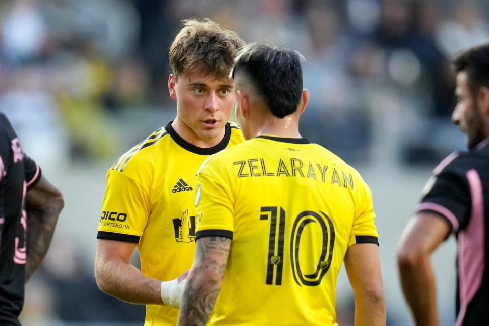 Crew midfielder Aidan Morris talks with midfielder Lucas Zelarayan during the game against Inter Miami on April 29.