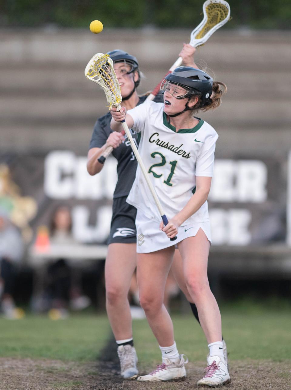 Libby Roberts (11) and Brinley Christiansen (21) try to win the draw during the South Walton vs Catholic girls District 1-1A championship lacrosse game at Pensacola Catholic High School on Thursday, April 13, 2023.