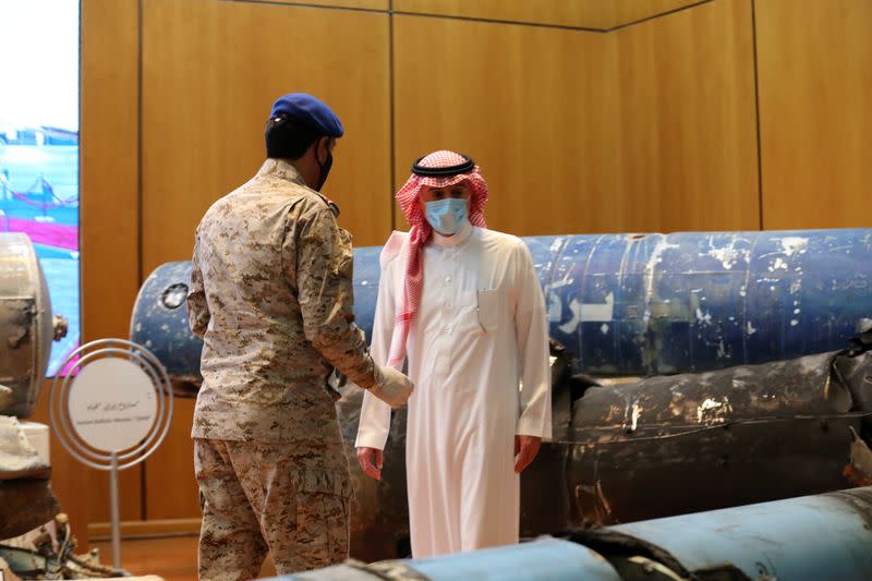 Saudi Arabia's Minister of State for Foreign Affairs Adel al-Jubeir, checks the display of the debris of ballistic missiles and weapons, in Riyadh