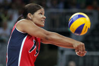 LONDON, ENGLAND - JULY 28: Prisilla Altagracia Rivera Brens #14 of Dominican Republic returns a shot to team Italy during Women's Volleyball on Day 1 of the London 2012 Olympic Games at Earls Court on July 28, 2012 in London, England. (Photo by Elsa/Getty Images)