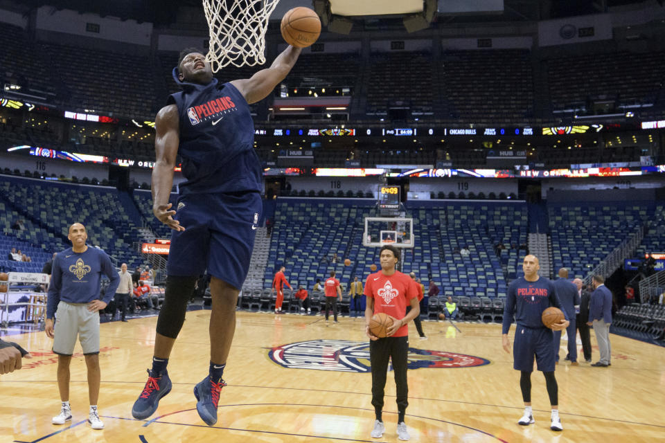 New Orleans Pelicans forward Zion Williamson goes up for a dunk before the start of an NBA basketball game against the Chicago Bulls in New Orleans, Wednesday, Jan. 8, 2020. Williamson is not scheduled to play. (AP Photo/Matthew Hinton)