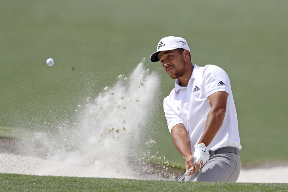 Xander Schauffele hits out of the bunker on the second green during the final round of the Masters golf tournament at Augusta National, Sunday, April 11, 2021, in Augusta, Ga. (Curtis Compton/Atlanta Journal-Constitution via AP)