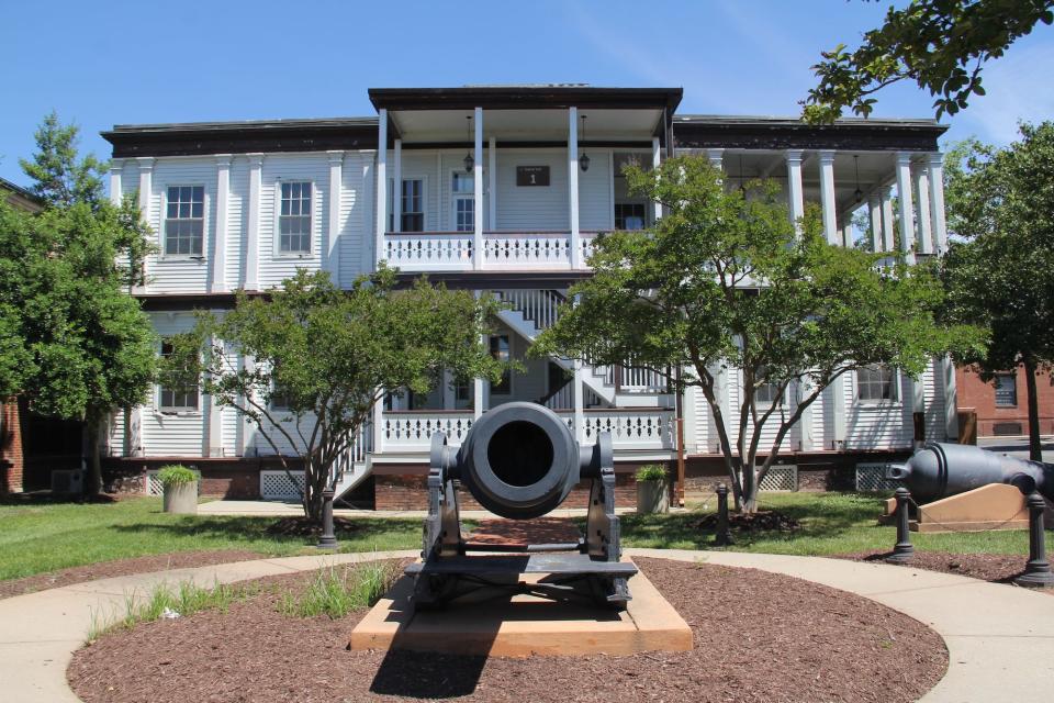 A building and canon at the National Museum of the United States Navy.