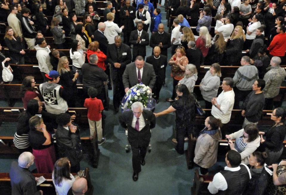 The casket is brought down the aisle for the recessional during the funeral service for 5-year-old Jeremiah Oliver at Rollstone Congregational Church in Fitchburg, Mass., on Saturday, May 3, 2014. Jeremiah Oliver is the 5-year-old Fitchburg boy who disappeared in September 2013 and was found dead along Interstate 190 in Sterling, Mass., in April. (AP Photo/Worcester Telegram & Gazette, Paul Kapteyn)