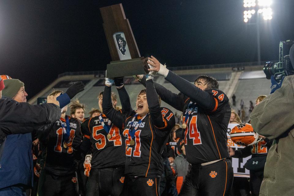 The Byron football team celebrates after winning the Class 3A state championship game on Friday, November 26, 2021 at Huskie Stadium in DeKalb.