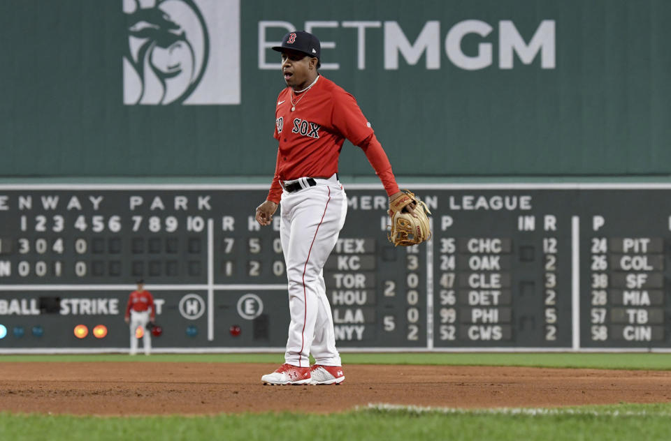 Boston Red Sox's shortstop Enmanuel Valdez reacts after an error on a ball hit by Minnesota Twins' Joey Gallo during the fifth inning of a baseball game at Fenway Park, Wednesday, April 19, 2023, in Boston. (AP Photo/Mark Stockwell)