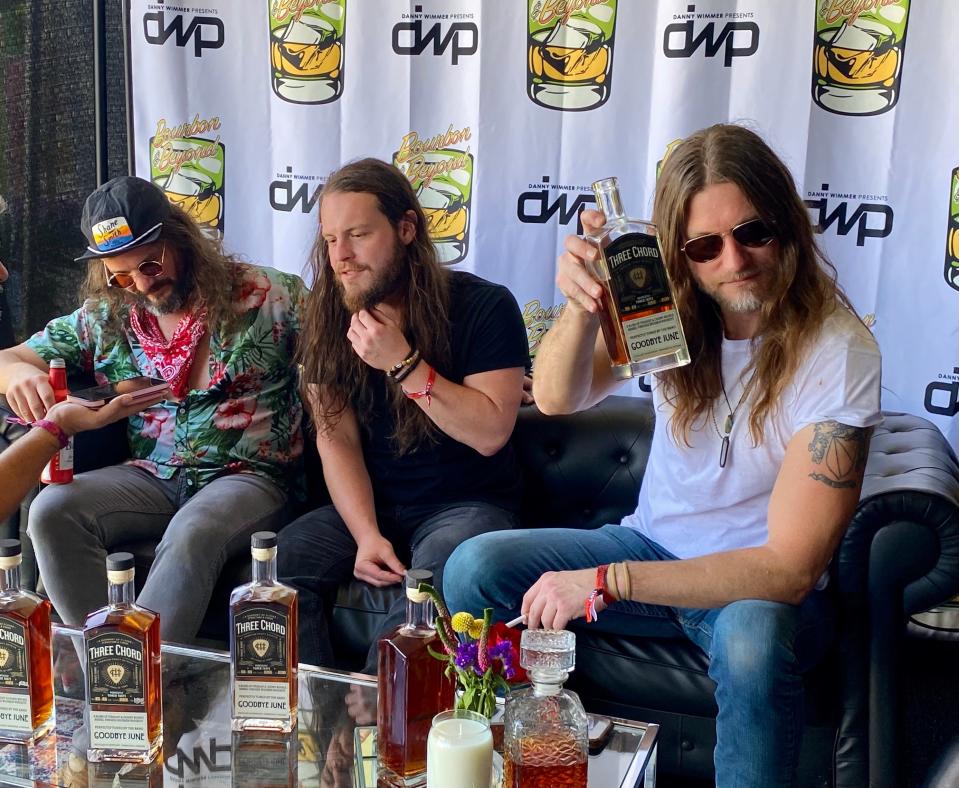 Members of Nashville rock band Goodbye June, from left: Tyler Baker, Landon Melbourne and Brandon Qualkenbush, showcase their bourbon brand Three Chord at Bourbon & Beyond in Louisville on Friday, Sept. 15, 2023.