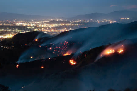 The La Tuna Canyon fire over Burbank. REUTERS/Kyle Grillot