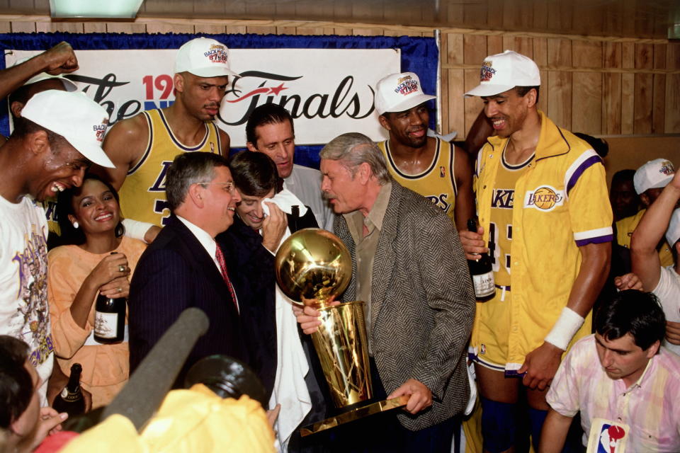 Los Angeles Lakers Owner Jerry Buss and the Los Angeles Lakers celebrate in the locker room after winning the 1987 NBA Finals against the Boston Celtics on June 14, 1987 in Los Angeles, California. Lakers 106 vs Celtics 93. (Photo by Andrew D. Bernstein/NBAE via Getty Images)