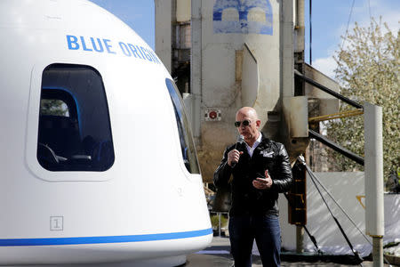 Amazon and Blue Origin founder Jeff Bezos addresses the media about the New Shepard rocket booster and Crew Capsule mockup at the 33rd Space Symposium in Colorado Springs, Colorado, United States April 5, 2017. REUTERS/Isaiah J. Downing