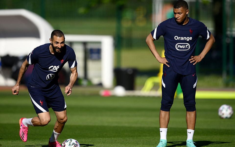 Karim Benzema (left) makes his return to the national squad  - AFP