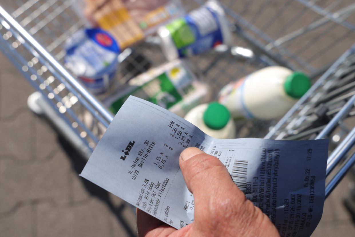 A shopper, who lamented that groceries have recently become much more expensive, holds the receipt from his purchase at a discount supermarket on June 15, 2022, in Berlin, Germany. (Photo by Sean Gallup/Getty Images)