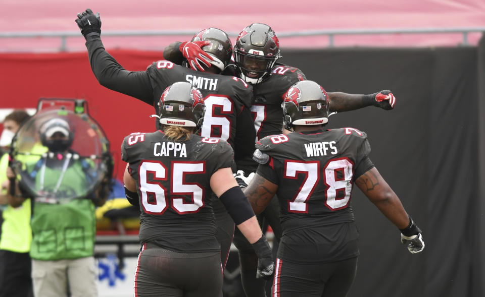 Tampa Bay Buccaneers running back Ronald Jones (27) celebrates after his score against the Atlanta Falcons during the second half of an NFL football game Sunday, Jan. 3, 2021, in Tampa, Fla. (AP Photo/Jason Behnken)