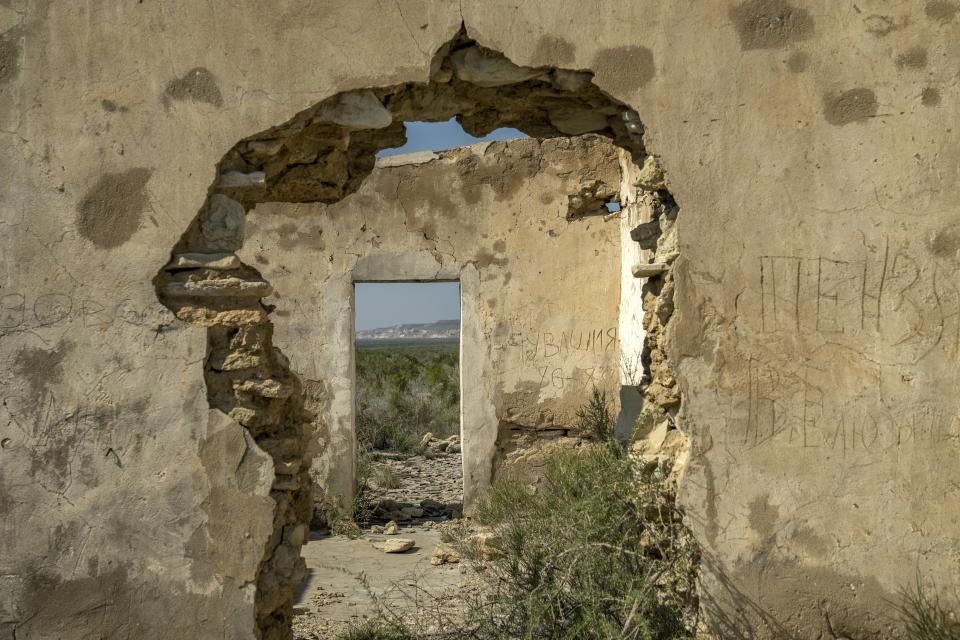 A former military base that was destroyed and evacuated after the drying up of the Aral Sea is visible in Uzbekistan, Sunday, June 25, 2023. (AP Photo/Ebrahim Noroozi)