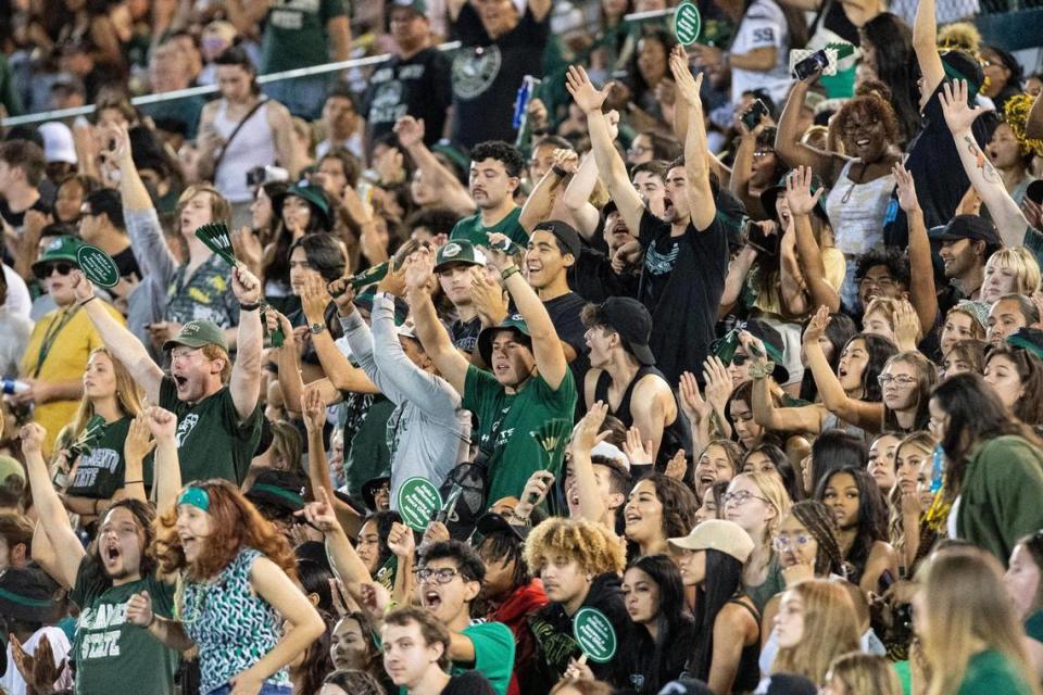 Sacramento State students celebrate the field goal to end the first half of the NCAA football game at Hornet Stadium on Saturday.