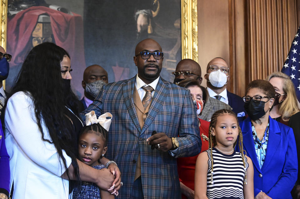 Philonise Floyd, the brother of George Floyd, center, speaks next to Gianna Floyd, George Floyd's daughter, second left, while while standing with members of the Floyd family prior to a meeting to mark the anniversary of the death of George Floyd with House Speaker Nancy Pelosi, D-Calif., Tuesday, May 25, 2021 at the Capitol in Washington. (Erin Scott/Pool via AP)