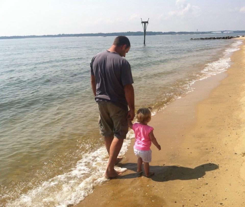Bruce Sampson and his 9-year-old daughter Molly Samsung stroll along the Atlantic Ocean when the girl was a toddler.