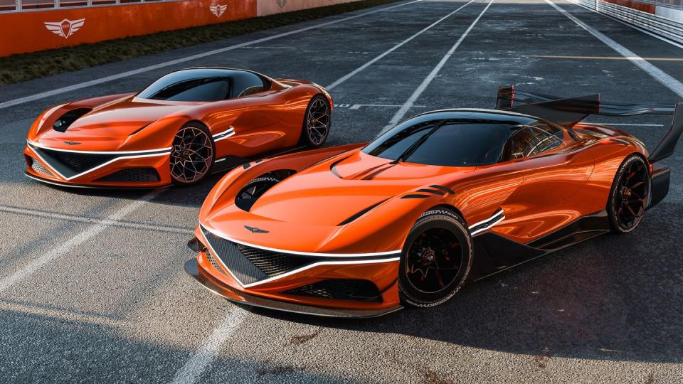 some sports cars parked on a road