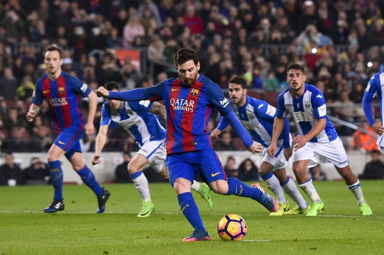 Barcelona's forward Lionel Messi shoots a penalty kick to score a goal on February 19, 2017