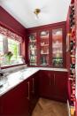 <p>This red pantry from Herringbone will tempt you to ditch conventional coloured cabinetry. Offering a grown-up approach to kitchen design, it has been complemented by brass handles and marvellous marble worktops. </p><p>• See more from <a href="https://www.herringbonekitchens.com/" rel="nofollow noopener" target="_blank" data-ylk="slk:Herringbone;elm:context_link;itc:0;sec:content-canvas" class="link ">Herringbone</a> </p>