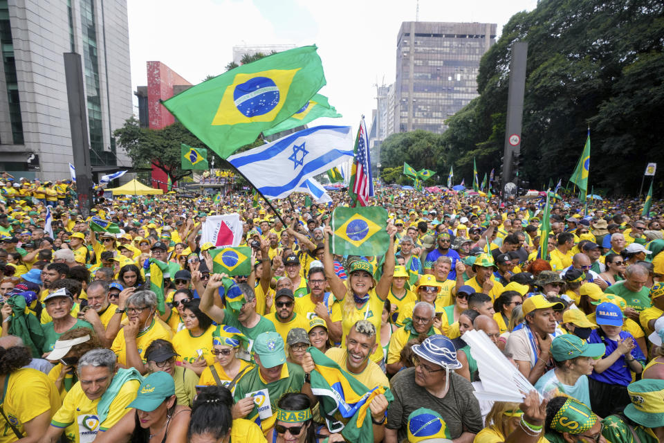 FILE - Thousands of people gather to show their support for former Brazilian President Jair Bolsonaro in Sao Paulo., Brazil, Feb. 25, 2024. Bolsonaro retains staunch allegiance among his political base who gathered on Sao Paulo’s main boulevard to decry what they — and the former president — characterize as political persecution. (AP Photo/Andre Penner, File)