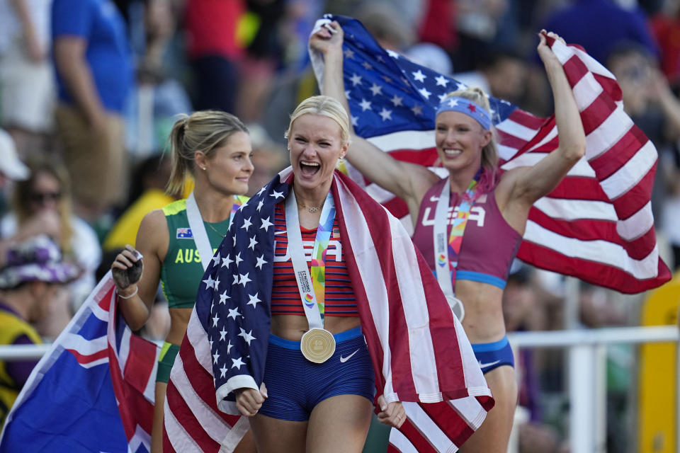 Gold medalist Katie Nageotte, of the United States, walks with silver medalist Sandi Morris, of the United States, right, and Nina Kennedy, of Australia, after the women's pole vault final at the World Athletics Championships on Sunday, July 17, 2022, in Eugene, Ore. (AP Photo/Ashley Landis)