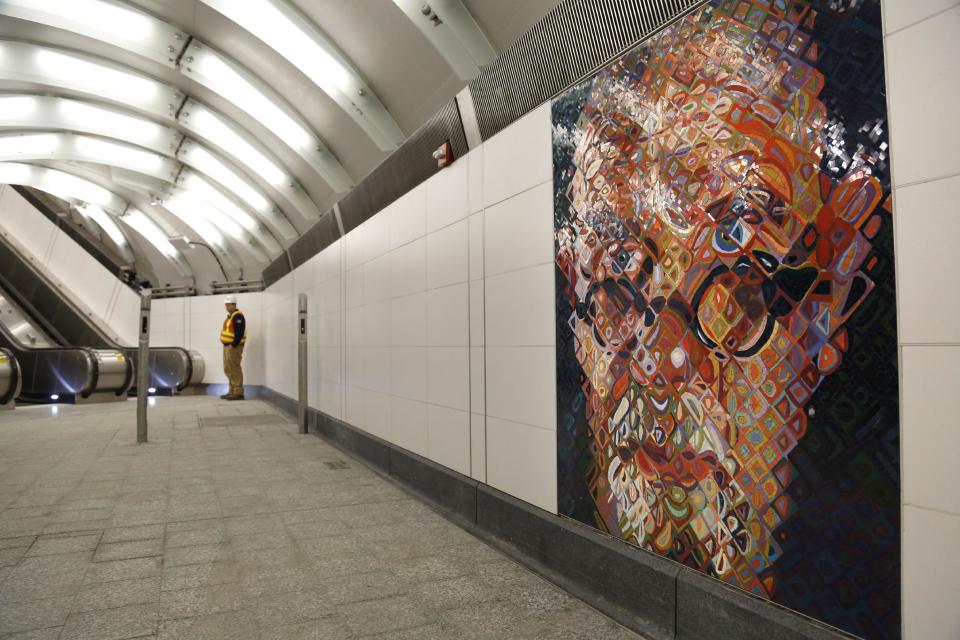 FILE - In this Dec. 22, 2016 file photo, mosaics by artist Chuck Close adorn the walls of the new 86th Street subway station on the Second Avenue line in New York. Passengers can begin riding the new line on Sunday, Jan. 1, 2017. (AP Photo/Seth Wenig, File)