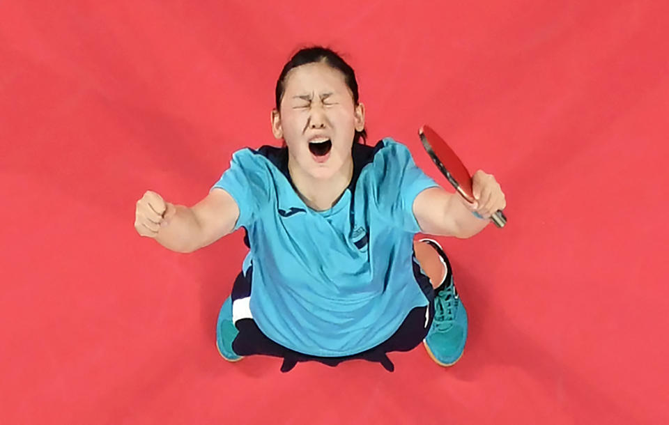 An overview image shows Spain's Maria Xiao celebrating her victory over Hong Kong's Minnie Soo Wai-yam during her women's singles round 2 table tennis match at the Tokyo Metropolitan Gymnasium during the Tokyo 2020 Olympic Games in Tokyo on July 25, 2021. (Photo by Jung Yeon-je / POOL / AFP) (Photo by JUNG YEON-JE/POOL/AFP via Getty Images)