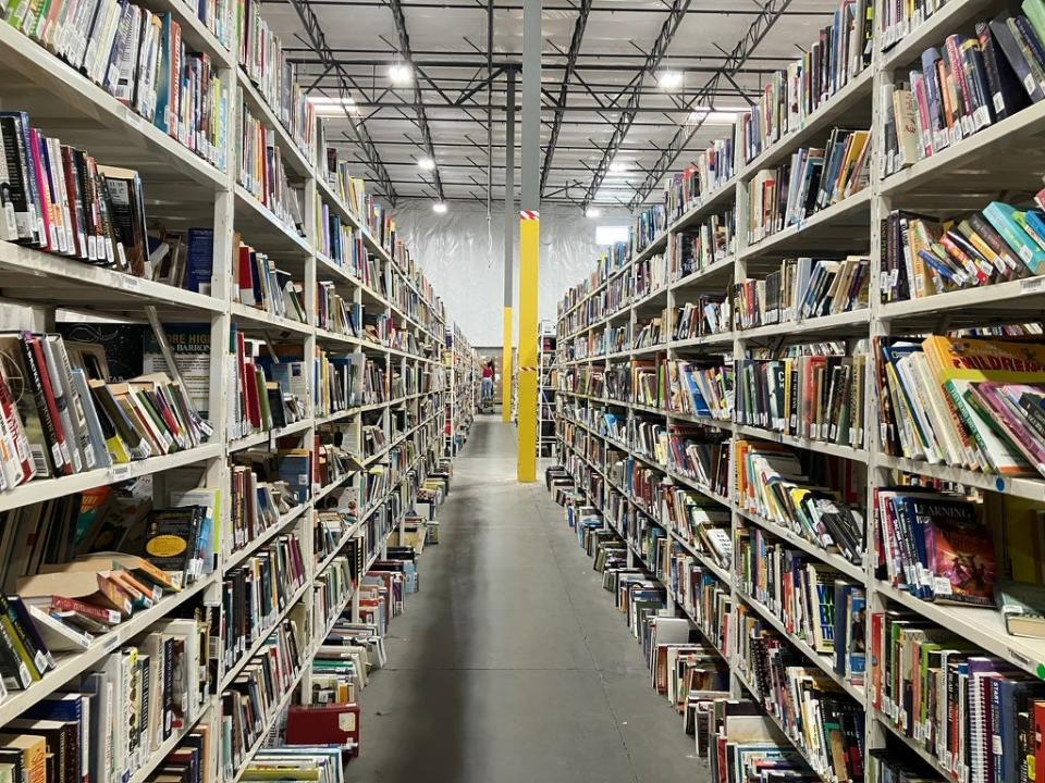 Online book retailer Thriftbooks processes thousands of used books every day in its Phoenix warehouse, the largest of five processing facilities across the United States. Pictured on Oct. 20, 2023.