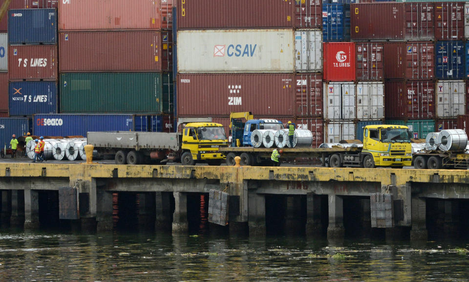 File Photo: Shipping containers of Philippine products for export sit stacked along the docks of the international container port in Manila. (Photo: JAY DIRECTO/AFP/GettyImages)