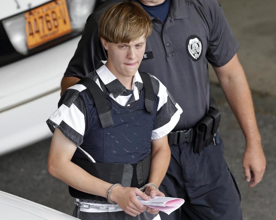 FILE - In this June 18, 2015 file photo, Charleston, S.C., shooting suspect Dylann Storm Roof is escorted from the Cleveland County Courthouse in Shelby, N.C. The sentencing phase of Roof's federal trial begins Wednesday, Jan. 4, 2016, in Charleston. He could face the death penalty or life in prison. (AP Photo/Chuck Burton, File)