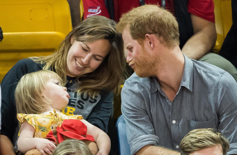 The 32-year-old Prince pulled faces as he kept the little girl entertained.