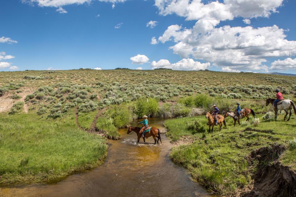 Horseback riding at Brush Creek Ranch.