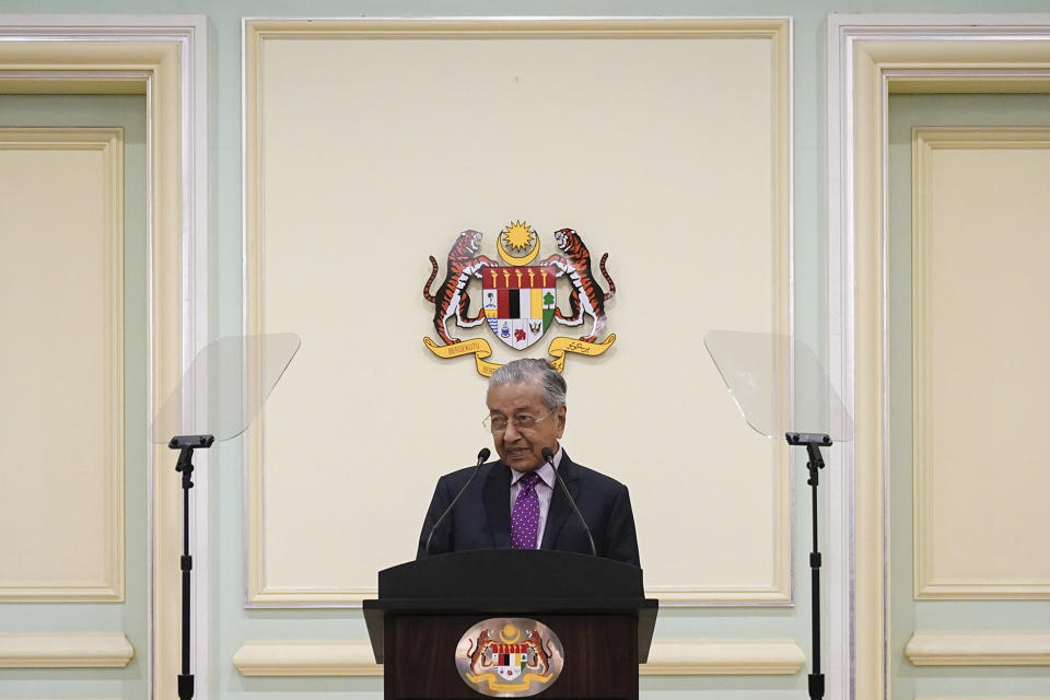Malaysian interim leader Mahathir Mohamad speaks during a press conference at his office in Putrajaya, Malaysia, Thursday, Feb. 27, 2020. Mahathir says Parliament will pick a new prime minister after the king failed to establish who has majority support following the collapse of the ruling coalition. (AP Photo/Vincent Thian)