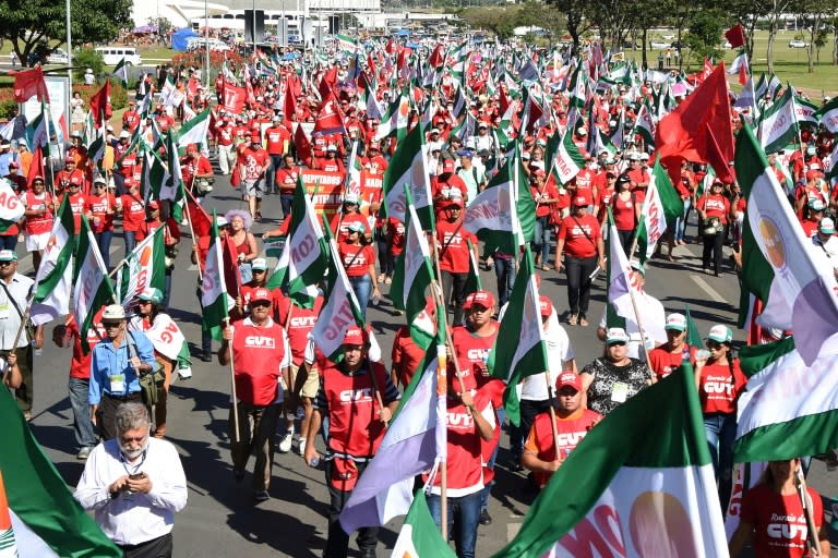 Members of Brazilian social movements march in Brasilia during a national strike against a government's Brazilian Social Welfare reform project on March 15, 2017