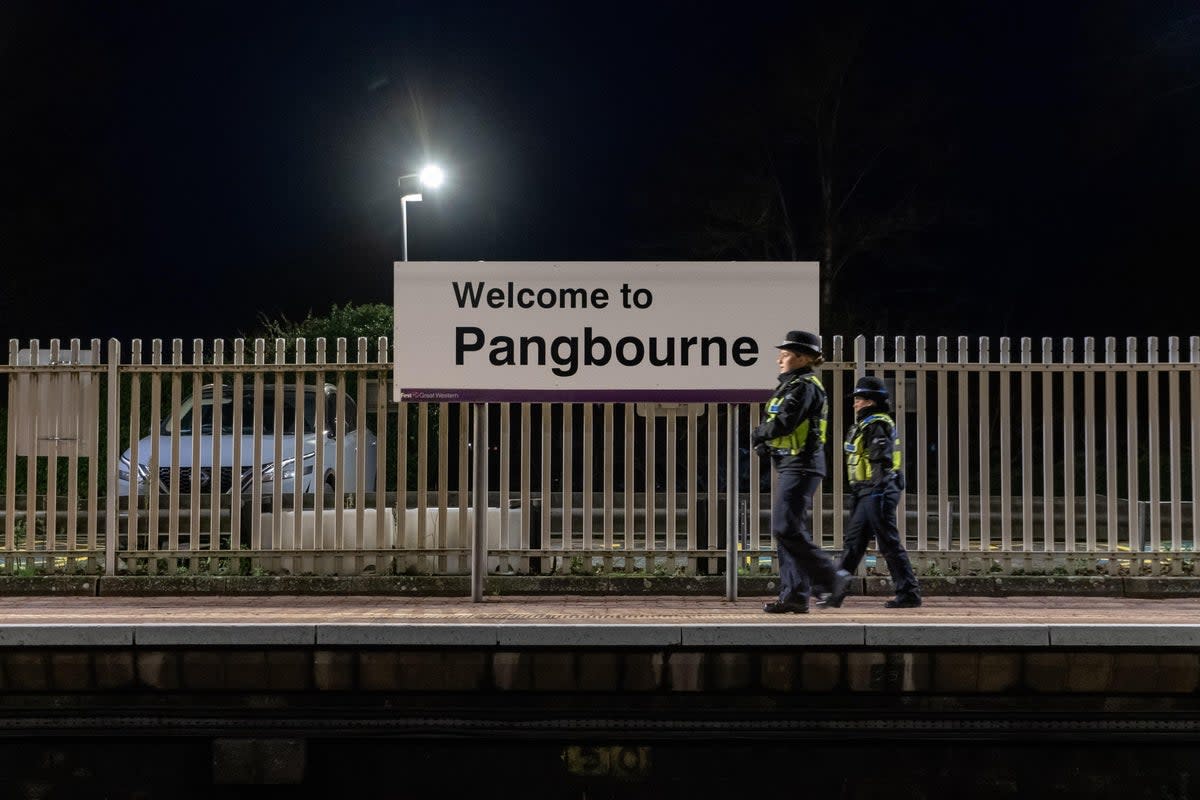 Police officers at Pangbourne station (James Street/PA) (PA Wire)