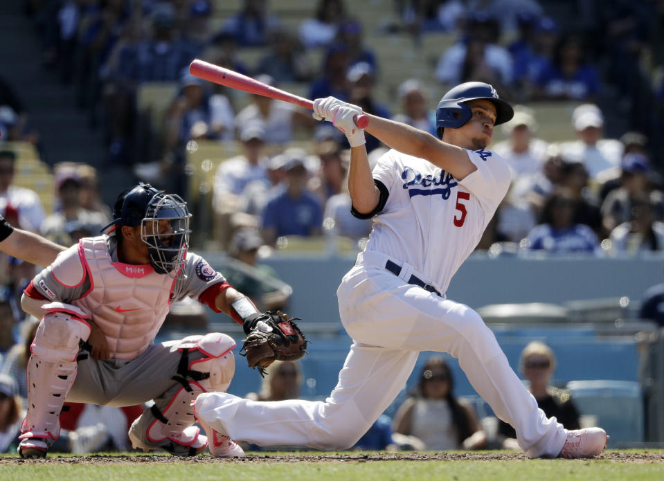 Los Angeles Dodgers' Corey Seager follows through on his grand slam home run against the Washington Nationals during the eighth inning of a baseball game Sunday, May 12, 2019, in Los Angeles. (AP Photo/Marcio Jose Sanchez)