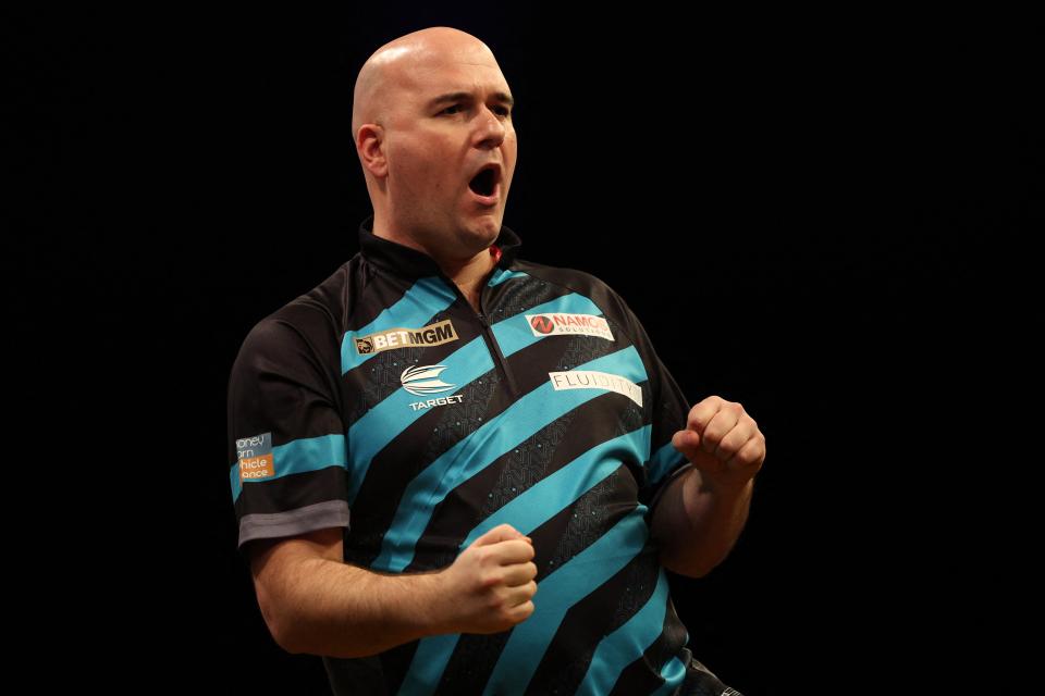 Rob Cross celebrates after securing victory (AFP via Getty Images)
