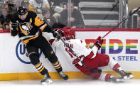 Pittsburgh Penguins' Evgeni Malkin (71) collides with Carolina Hurricanes' Jordan Staal during the first period of an NHL hockey game in Pittsburgh, Tuesday, March 26, 2024. (AP Photo/Gene J. Puskar)
