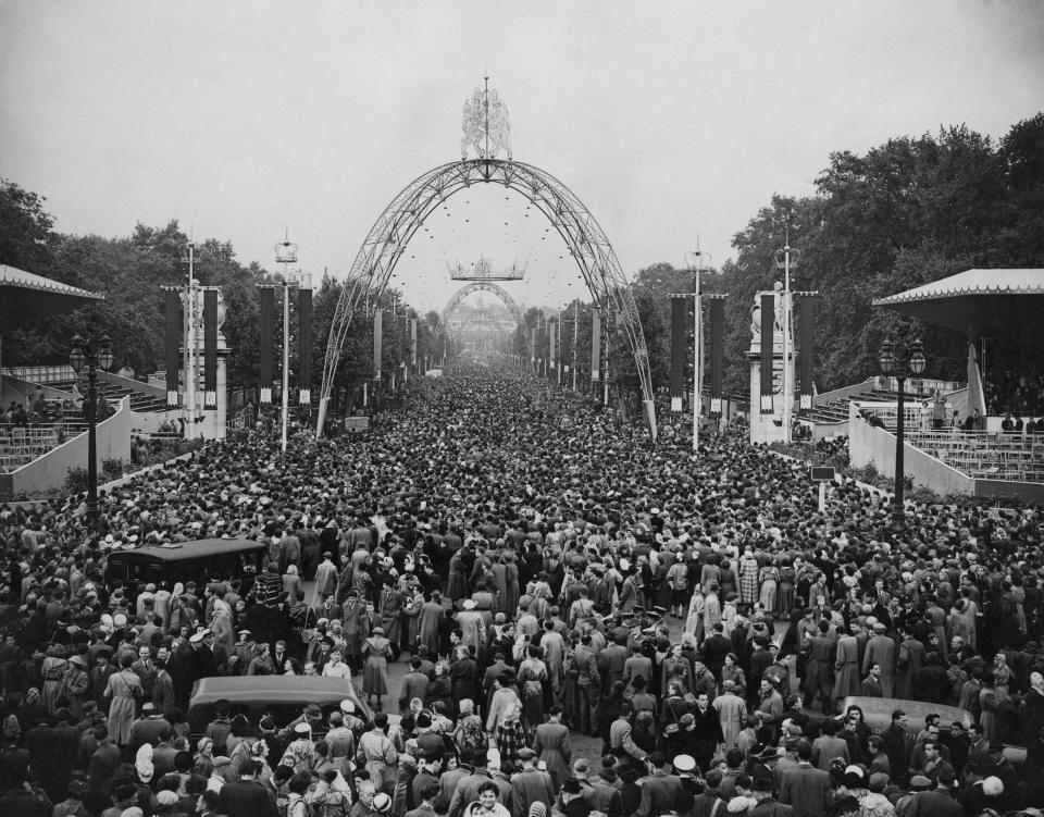 A crowd gathers to watch the return of Queen Elizabeth II to the Palace after the Coronation State Drive through London, on June 2, 1953.<span class="copyright">Reg Burkett—Keystone/Getty Images</span>