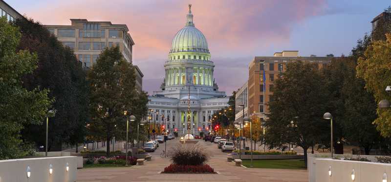 Wisconsin state capitol building at dusk.