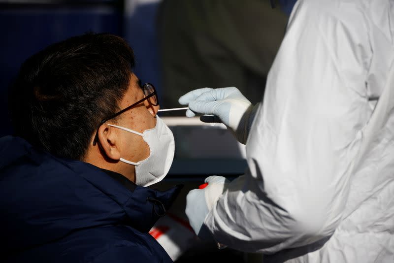A man undergoes coronavirus disease (COVID-19) test at a coronavirus testing site in Seoul